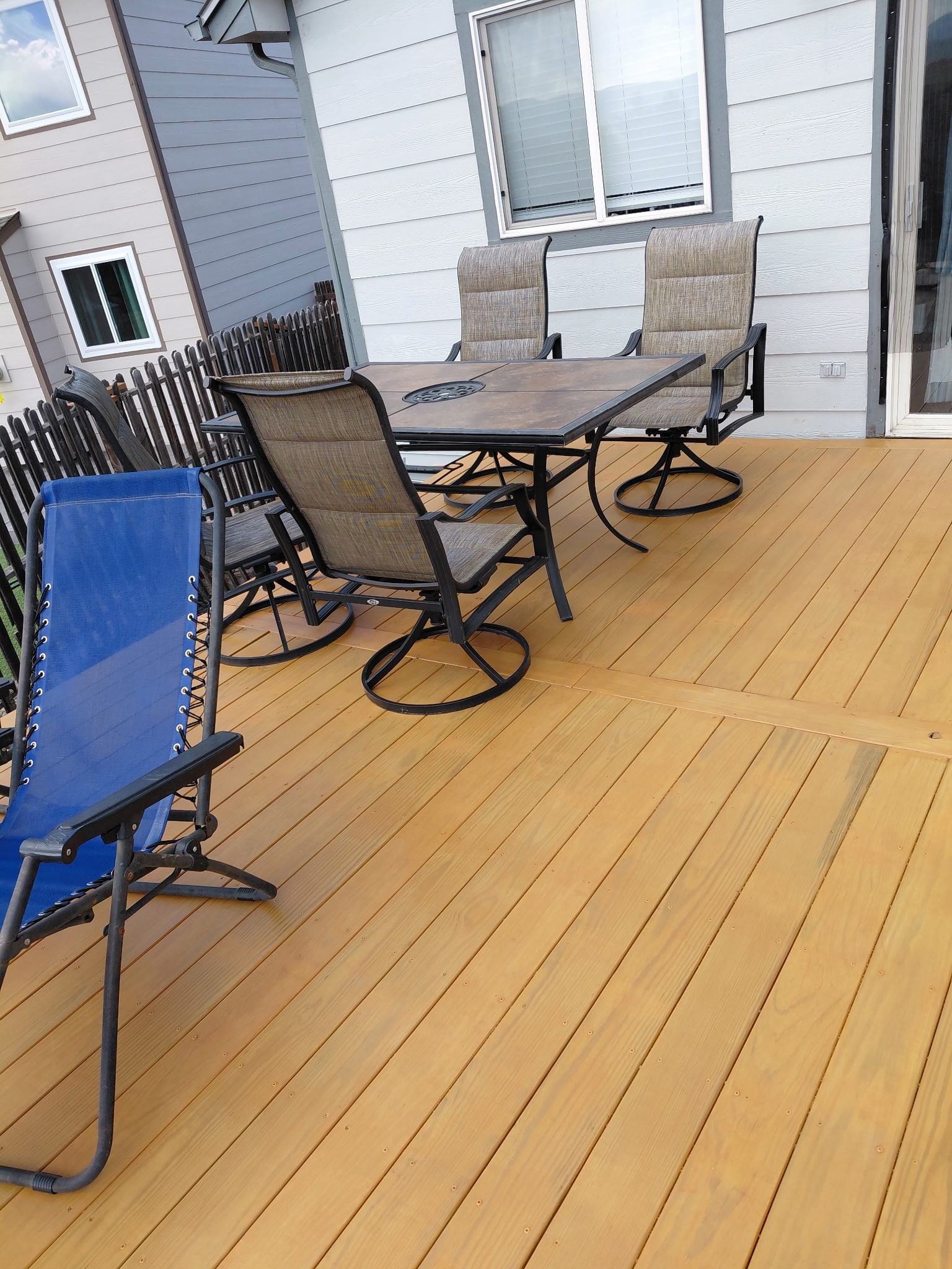Top view of the freshly stained deck with patio furniture