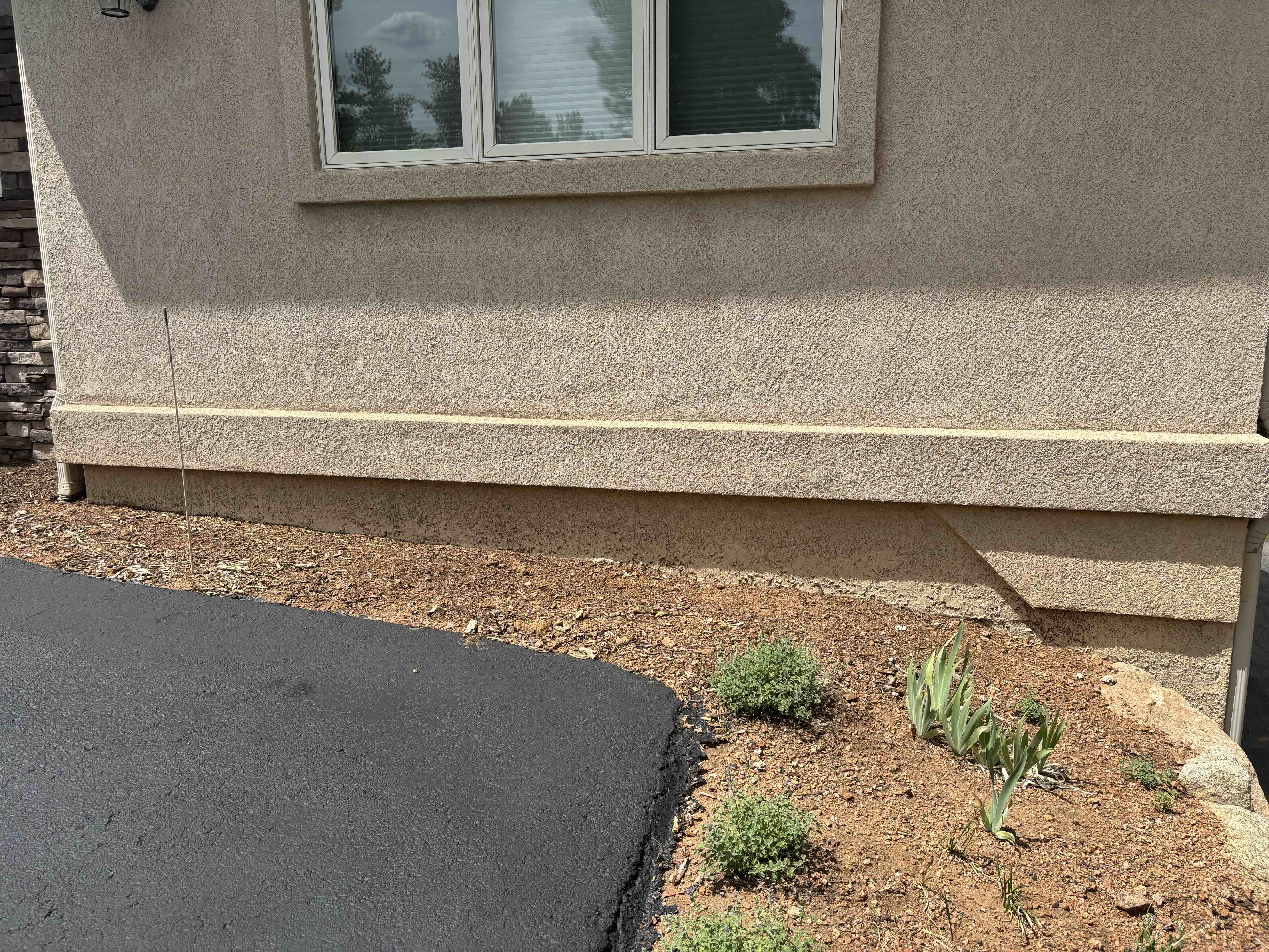 Repaired stucco wall with matching texture and finish